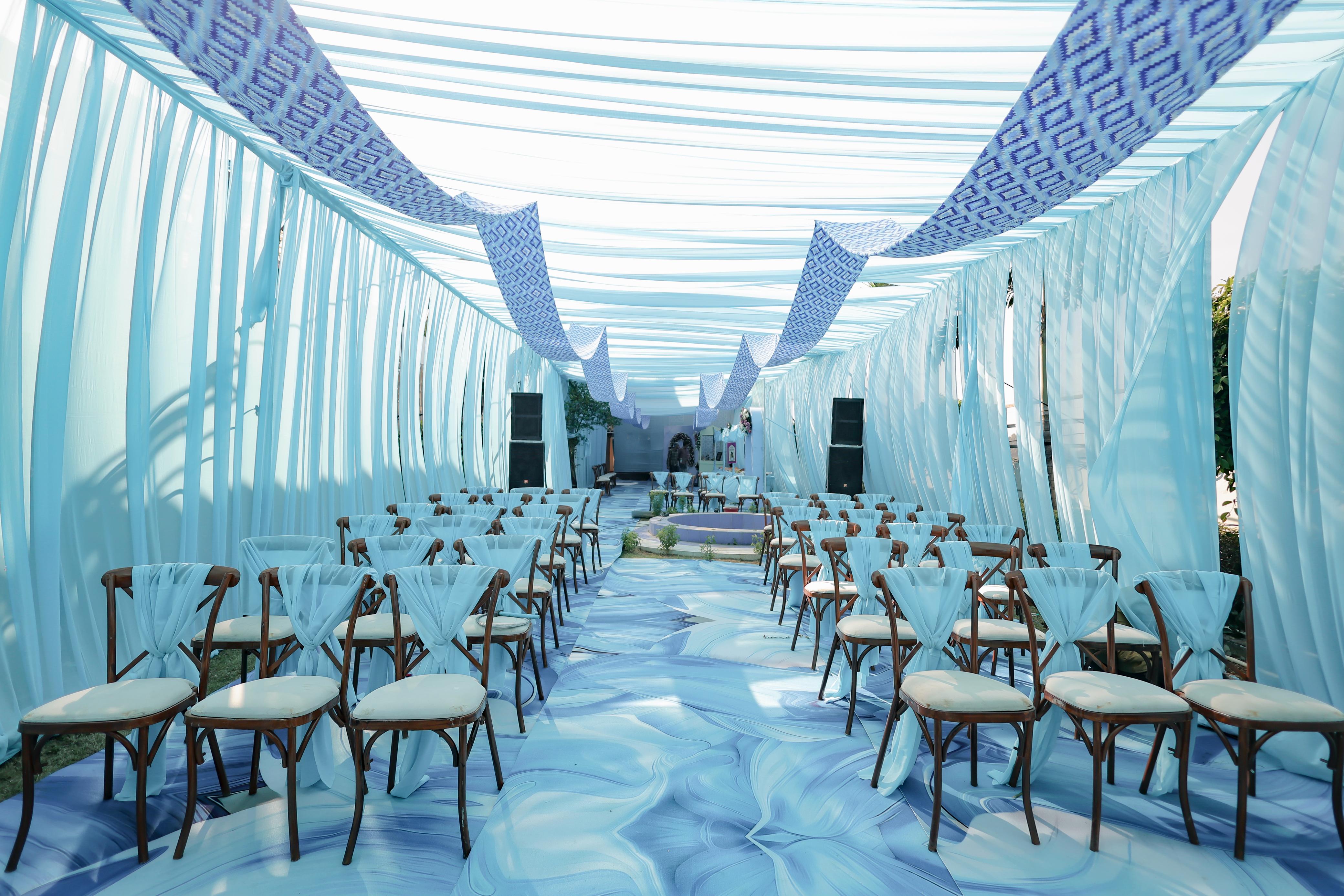 Blue outdoor ceremony seating at Raj Garden